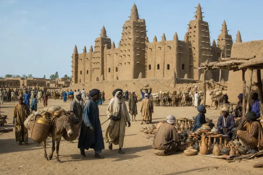 Illustrated market scene beside the Great Mosque of Djenné with earthen architecture